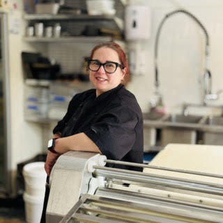 Scerena Thompson, founder of The Empowered Oven, in her commercial kitchen